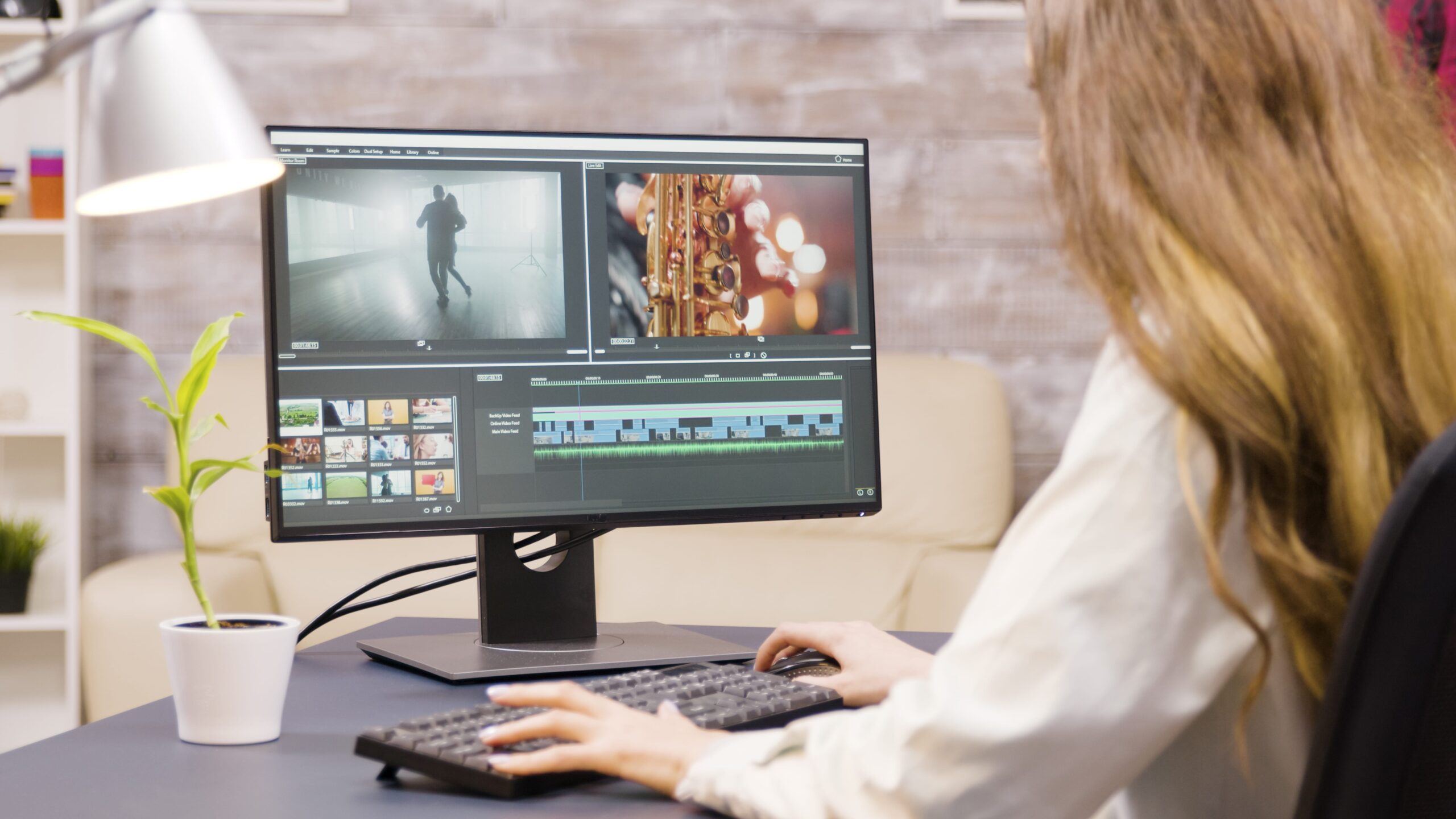 creative-female-filmmaker-working-post-production-movie-from-home-boyfriend-background-min